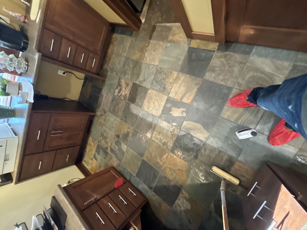 Slate tile floor cleaning in a kitchen